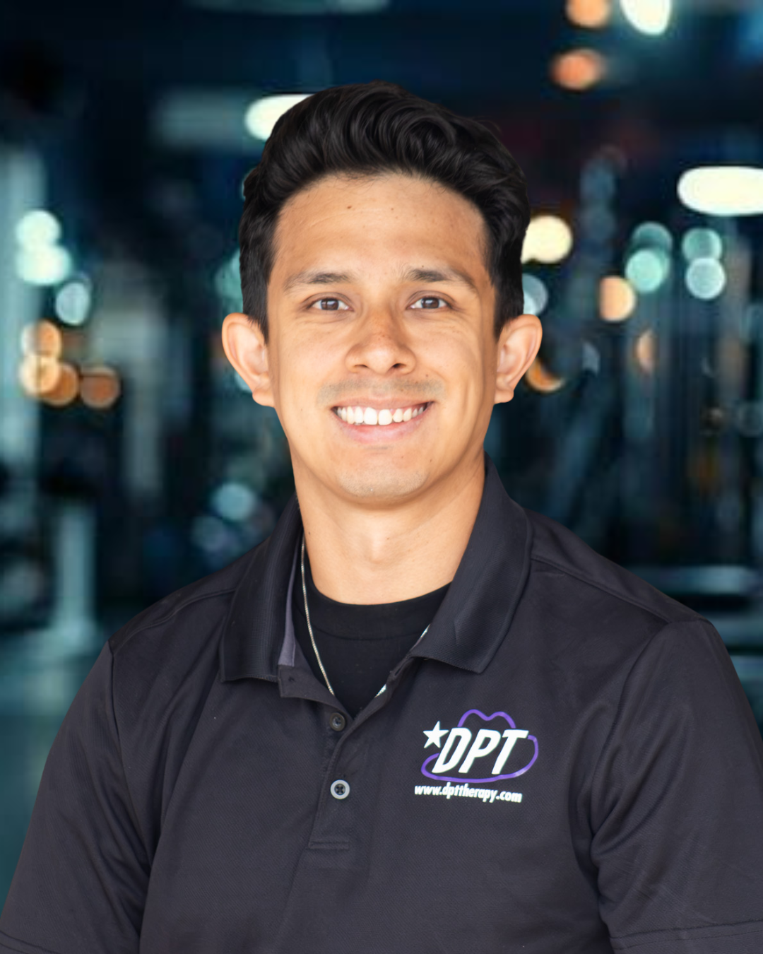 Dr. Christian Sanchez, physical therapist at DPT Physical Therapy’s Lubbock location, smiling for a professional headshot.