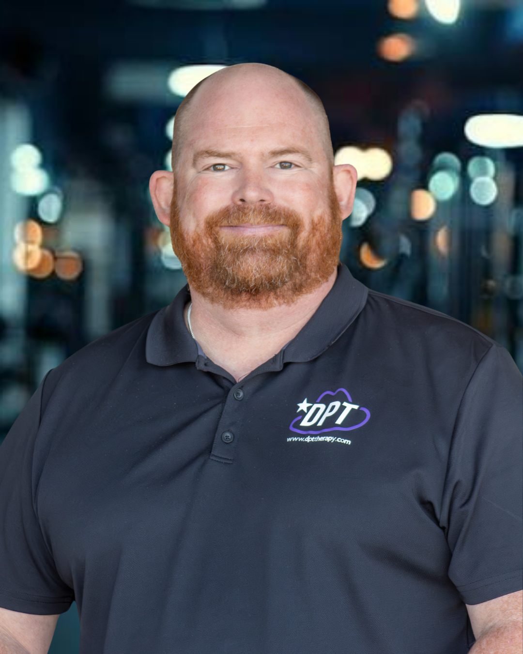 Dr. Derek Haney, physical therapist at DPT Physical Therapy’s Stephenville location, smiling for a professional headshot.