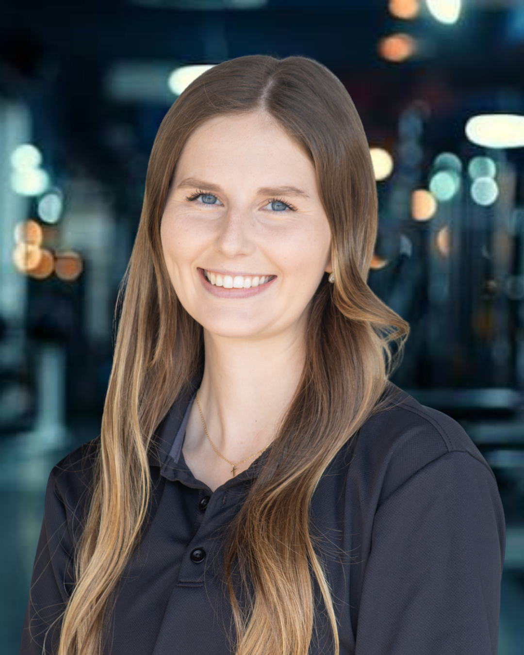 Dr. Taylor Fellers, physical therapist at DPT Physical Therapy’s Glen Rose location, smiling for a professional headshot.